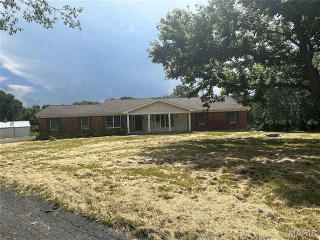 17300 W Bridle Trl, Wildwood, MO 63038 - ranch-style home with brick siding and a front yard