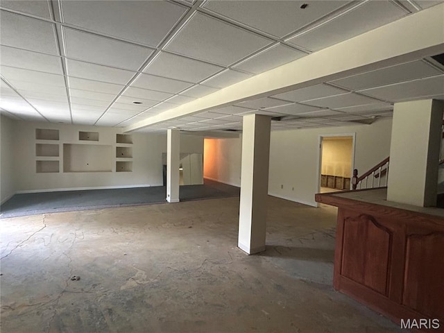 17300 W Bridle Trl, Wildwood, MO 63038 - below grade area with built in shelves, stairway, and a paneled ceiling