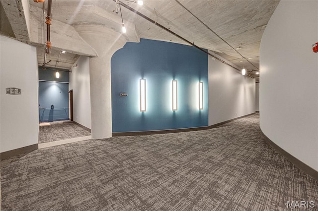 4100 Forest Park Ave Unit 306, Saint Louis, MO 63108 - spare room featuring carpet floors and baseboards