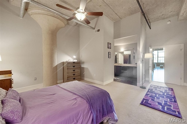 4100 Forest Park Ave Unit 306, Saint Louis, MO 63108 - carpeted bedroom with connected bathroom and a ceiling fan