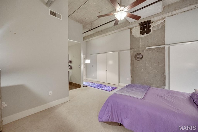 4100 Forest Park Ave Unit 306, Saint Louis, MO 63108 - carpeted bedroom featuring ceiling fan and a towering ceiling