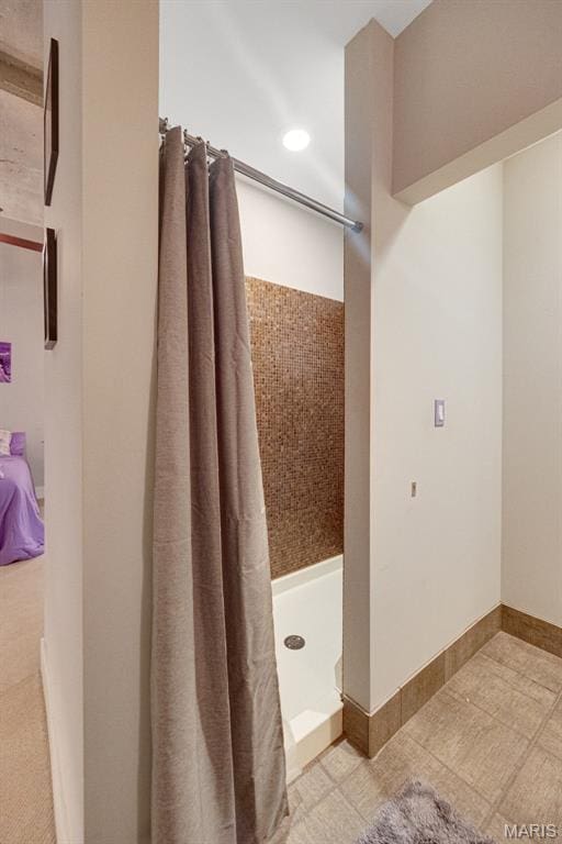 4100 Forest Park Ave Unit 306, Saint Louis, MO 63108 - bathroom with a stall shower and recessed lighting