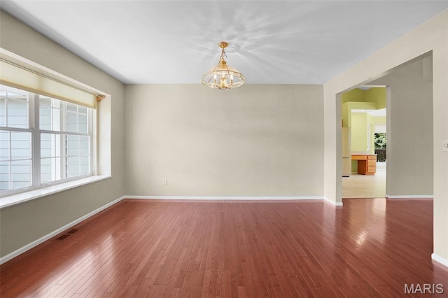 1473 Crooked Stick Dr, Ofallon, MO 63366 - unfurnished room with a chandelier and hardwood / wood-style floors