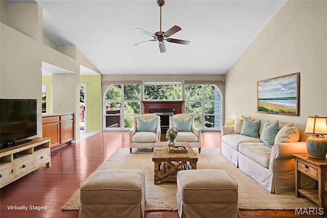 1473 Crooked Stick Dr, Ofallon, MO 63366 - living room featuring a ceiling fan, dark wood finished floors, a fireplace, and high vaulted ceiling