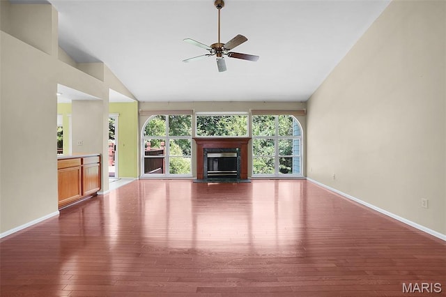 1473 Crooked Stick Dr, Ofallon, MO 63366 - unfurnished living room featuring hardwood / wood-style floors, a ceiling fan, a glass covered fireplace, and high vaulted ceiling