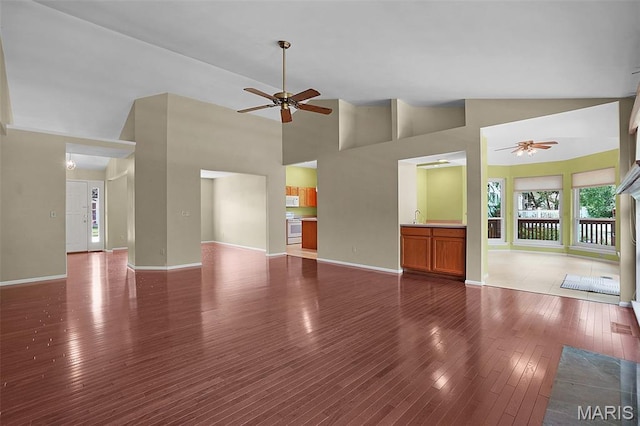 1473 Crooked Stick Dr, Ofallon, MO 63366 - unfurnished living room featuring ceiling fan, dark wood finished floors, and high vaulted ceiling
