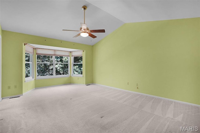 1473 Crooked Stick Dr, Ofallon, MO 63366 - empty room featuring a ceiling fan, lofted ceiling, and carpet flooring