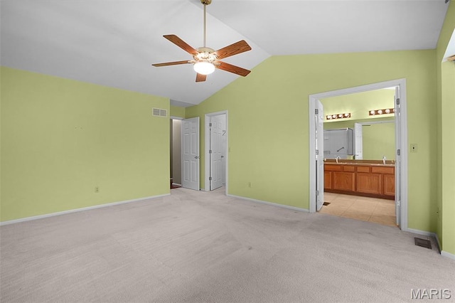 1473 Crooked Stick Dr, Ofallon, MO 63366 - unfurnished bedroom with light carpet, lofted ceiling, ensuite bathroom, and a ceiling fan
