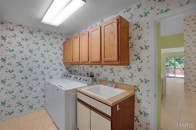 1473 Crooked Stick Dr, Ofallon, MO 63366 - laundry area featuring cabinet space, washing machine and dryer, light tile patterned flooring, and wallpapered walls