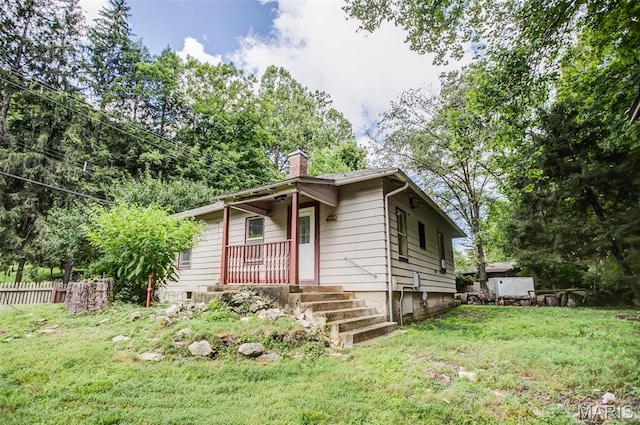 86 Mill St, Elsah, IL 62028 - view of front of home featuring a chimney and covered porch