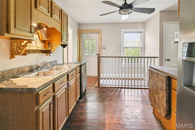 86 Mill St, Elsah, IL 62028 - kitchen with a ceiling fan, dark wood finished floors, brown cabinetry, and appliances with stainless steel finishes