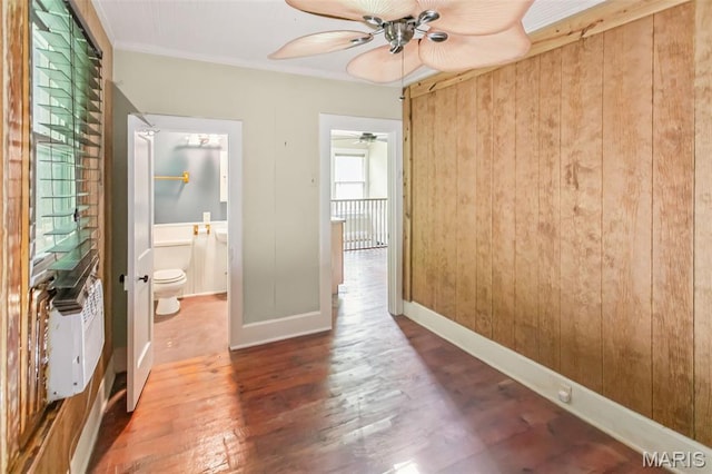 86 Mill St, Elsah, IL 62028 - unfurnished bedroom with wood finished floors, ornamental molding, wooden walls, and ensuite bath