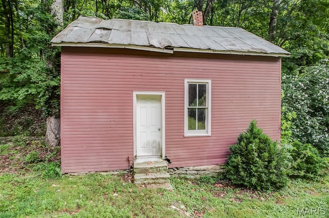 86 Mill St, Elsah, IL 62028 - back of property with entry steps, an outdoor structure, and a chimney