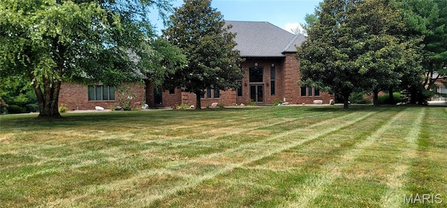 517 E Waters Edge Dr, Shiloh, IL 62221 - view of front of property with a front yard and brick siding