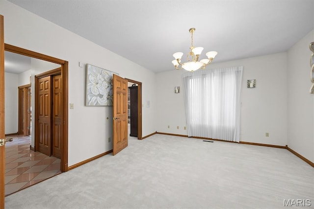 517 E Waters Edge Dr, Shiloh, IL 62221 - unfurnished dining area featuring a chandelier and light carpet
