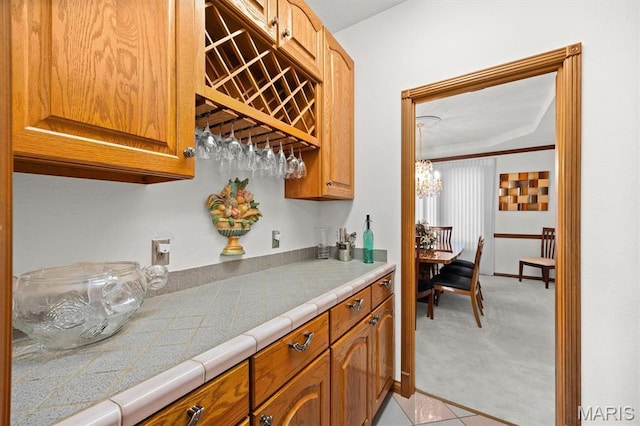 517 E Waters Edge Dr, Shiloh, IL 62221 - indoor dry bar with light colored carpet and a chandelier