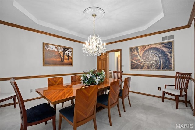 517 E Waters Edge Dr, Shiloh, IL 62221 - dining space featuring a tray ceiling, light colored carpet, a chandelier, and ornamental molding