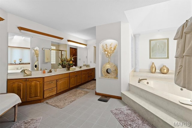 517 E Waters Edge Dr, Shiloh, IL 62221 - bathroom featuring a bath, double vanity, tile patterned flooring, and a stall shower