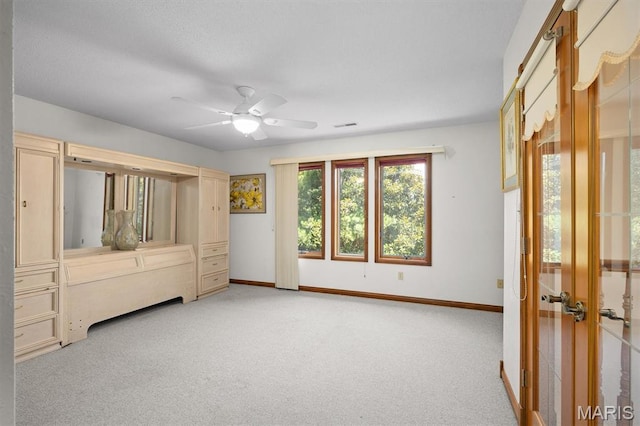 517 E Waters Edge Dr, Shiloh, IL 62221 - unfurnished bedroom featuring light colored carpet, a ceiling fan, and french doors