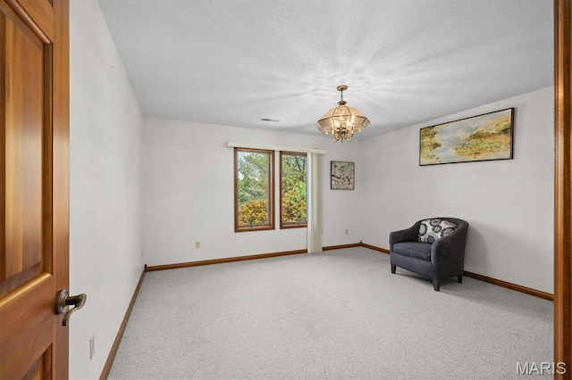 517 E Waters Edge Dr, Shiloh, IL 62221 - unfurnished room with carpet floors, a chandelier, and a textured ceiling