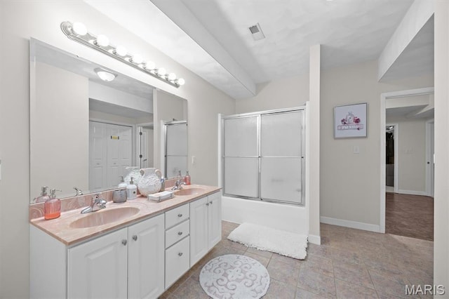 517 E Waters Edge Dr, Shiloh, IL 62221 - bathroom featuring double vanity, bath / shower combo with glass door, and tile patterned flooring
