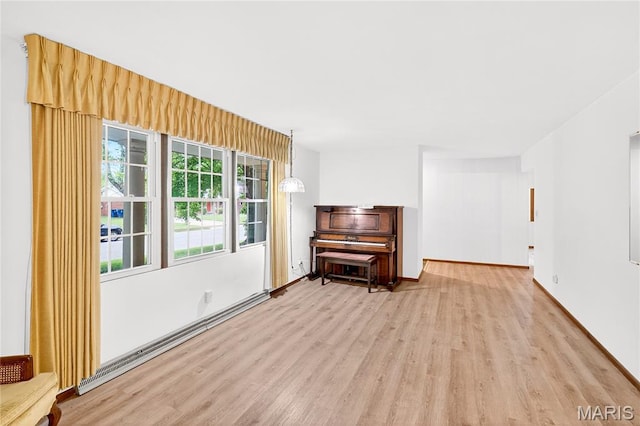 401 Willowbrook Ln, Collinsville, IL 62234 - living room featuring light wood-style flooring and baseboards