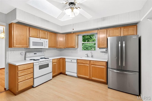 401 Willowbrook Ln, Collinsville, IL 62234 - kitchen featuring white appliances, light wood-type flooring, and light countertops