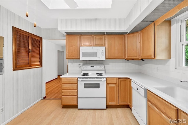 401 Willowbrook Ln, Collinsville, IL 62234 - kitchen with white appliances, light wood-style floors, decorative backsplash, and a skylight