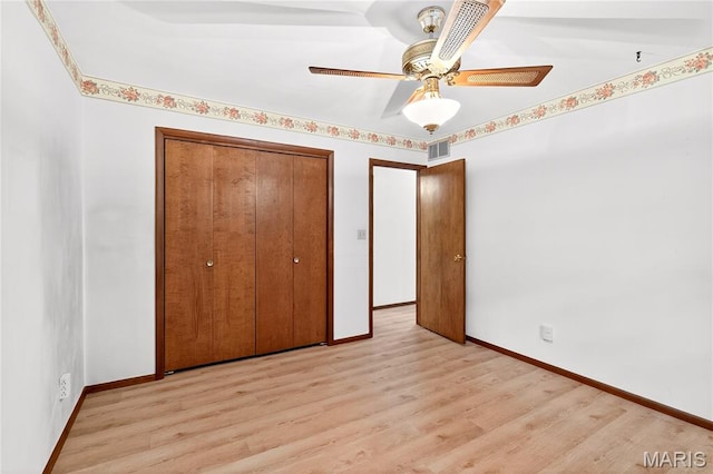 401 Willowbrook Ln, Collinsville, IL 62234 - unfurnished bedroom with light wood-style floors, a closet, and a ceiling fan