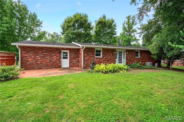 401 Willowbrook Ln, Collinsville, IL 62234 - back of property featuring a patio area, a yard, and brick siding