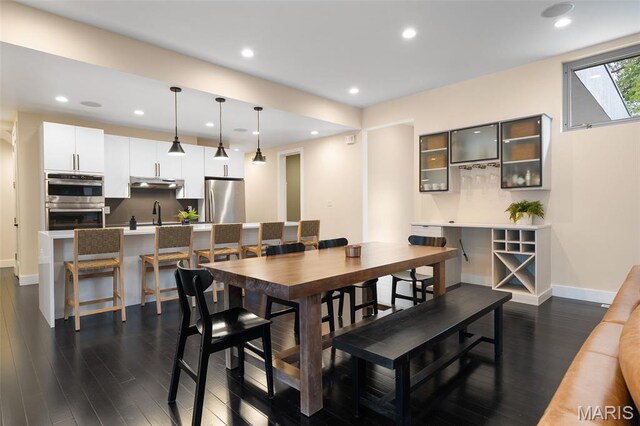 5951 Jamieson Ave, Saint Louis, MO 63109 - dining space with dark wood-type flooring and recessed lighting