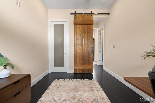 5951 Jamieson Ave, Saint Louis, MO 63109 - entrance foyer featuring a barn door and dark wood finished floors