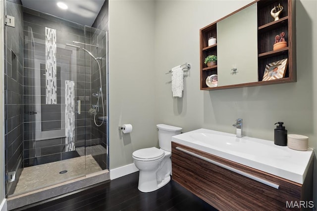 5951 Jamieson Ave, Saint Louis, MO 63109 - bathroom featuring vanity, a stall shower, and wood finished floors