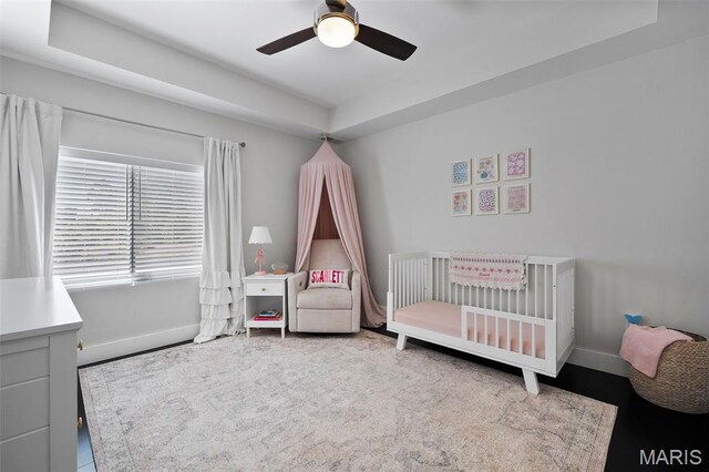 5951 Jamieson Ave, Saint Louis, MO 63109 - bedroom with a nursery area, ceiling fan, and a tray ceiling