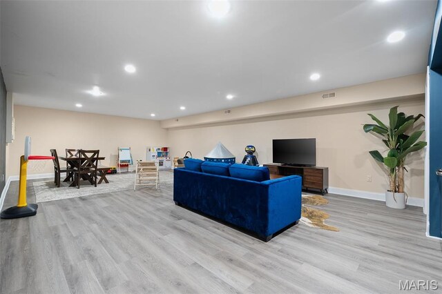 5951 Jamieson Ave, Saint Louis, MO 63109 - living area with wood finished floors and recessed lighting