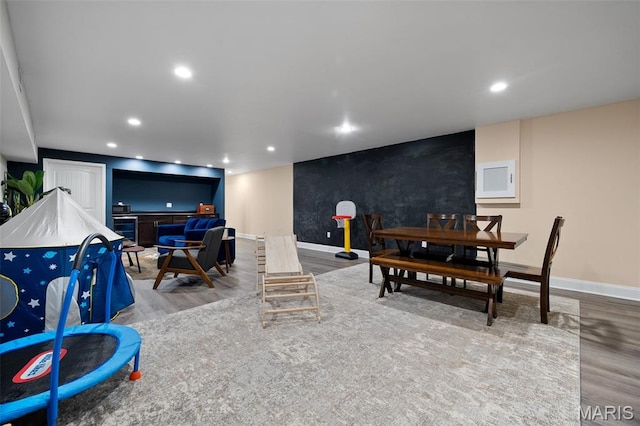 5951 Jamieson Ave, Saint Louis, MO 63109 - living room featuring wood finished floors and recessed lighting
