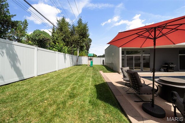 5951 Jamieson Ave, Saint Louis, MO 63109 - fenced backyard featuring an outdoor pool and a patio