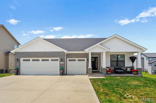 1433 Victoria Square Ct, Ofallon, IL 62269 - view of front of property featuring an outdoor living space, a garage, driveway, a front lawn, and a shingled roof