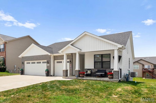 1433 Victoria Square Ct, Ofallon, IL 62269 - view of front of house with a garage, driveway, a front lawn, and a porch