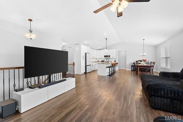 1433 Victoria Square Ct, Ofallon, IL 62269 - living area with lofted ceiling, ceiling fan, dark wood-type flooring, and a chandelier