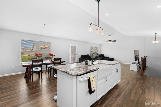 1433 Victoria Square Ct, Ofallon, IL 62269 - kitchen with white dishwasher, vaulted ceiling, ceiling fan, white cabinetry, and decorative light fixtures