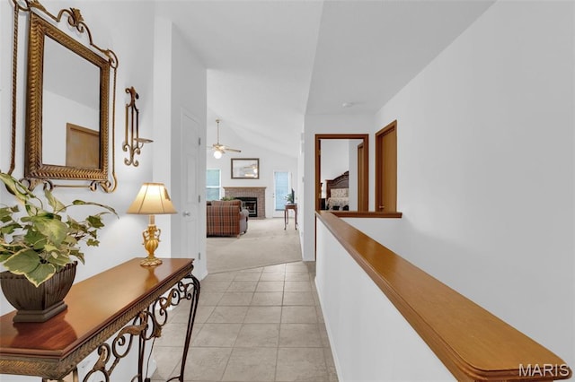 2961 Plum Leaf Cir, Saint Peters, MO 63303 - corridor featuring light carpet, lofted ceiling, and light tile patterned floors