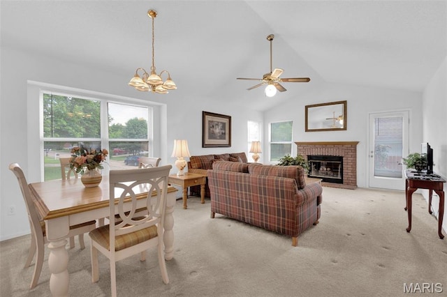 2961 Plum Leaf Cir, Saint Peters, MO 63303 - living area featuring vaulted ceiling, a fireplace, light carpet, ceiling fan, and a chandelier
