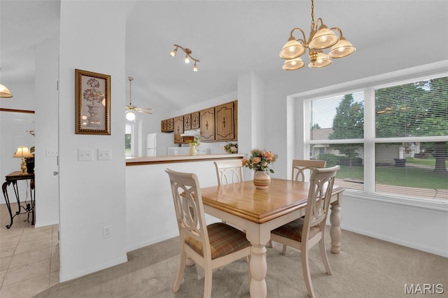 2961 Plum Leaf Cir, Saint Peters, MO 63303 - dining room with lofted ceiling, a chandelier, light tile patterned flooring, a ceiling fan, and light carpet