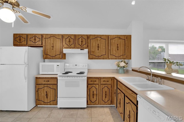 2961 Plum Leaf Cir, Saint Peters, MO 63303 - kitchen with white appliances, under cabinet range hood, brown cabinetry, and light countertops