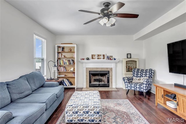 22 Dean Wells Ct, Warrenton, MO 63383 - living room with dark wood-style floors, ceiling fan, and a tiled fireplace