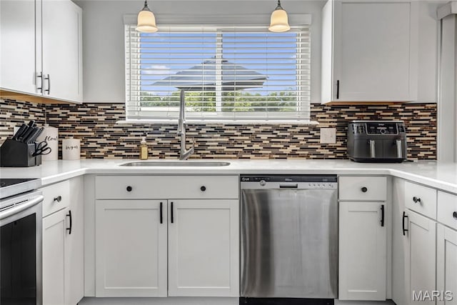 22 Dean Wells Ct, Warrenton, MO 63383 - kitchen featuring stainless steel dishwasher, white cabinetry, decorative backsplash, light countertops, and stove