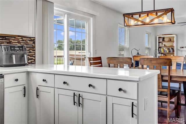 22 Dean Wells Ct, Warrenton, MO 63383 - kitchen with tasteful backsplash, light countertops, white cabinets, and decorative light fixtures