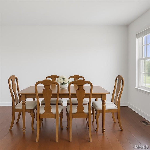 22 Dean Wells Ct, Warrenton, MO 63383 - dining space with baseboards and dark wood-style flooring