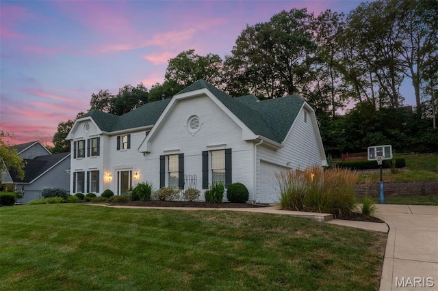 17527 Adams Way Ct, Wildwood, MO 63005 - view of front of home with a yard, brick siding, a garage, and a shingled roof